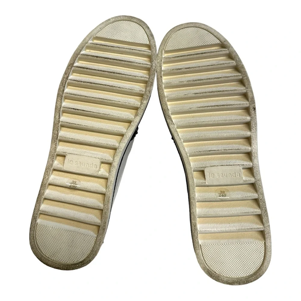 White Leather Slip-On Sneakers with Black Trim and Red Accent